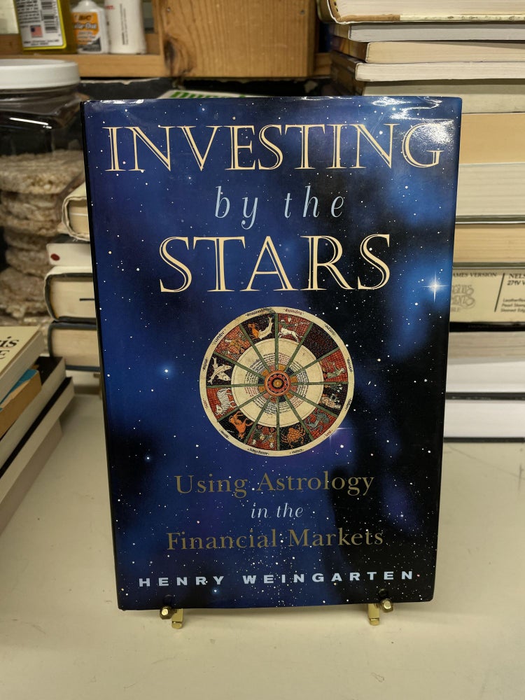Item #73448 Investing by the Stars: Using Astrology in the Financial Markets. Henry Weingarten.