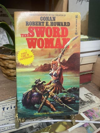 Item #89511 The Sword Woman. Robert E. Howard